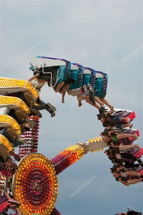 teens enjoy inverted carnival ride at fair stock editorial photo