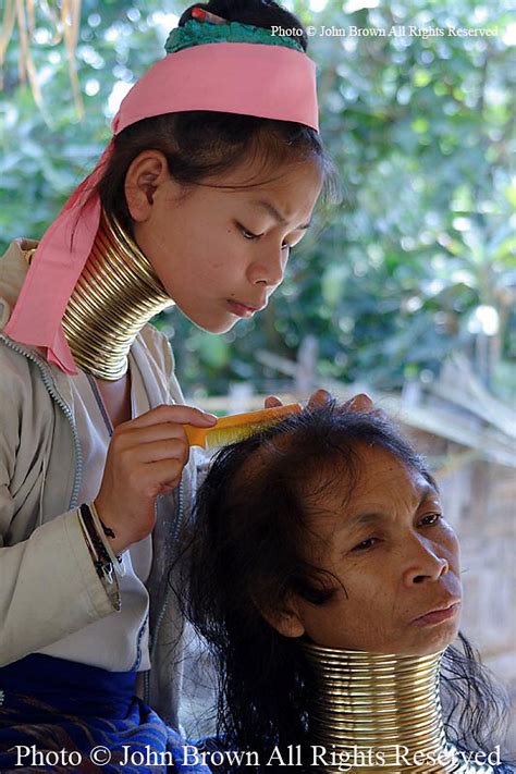 A Karen Paduang Refugee From Burma Myanmar Combs Her Mothers Hair In