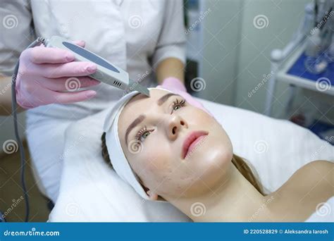 Cosmetologist Does Ultrasonic Cleaning Of The Face Women S Cosmetology