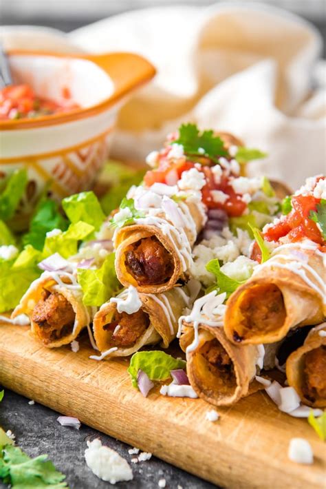 In a medium mixing bowl, combine chicken, cream cheese and cheese. The Best Homemade Taquitos | YellowBlissRoad.com
