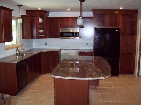Fast shipping and free kitchen design service. granite for cherry wood cabinets | Were not done yet, but ...