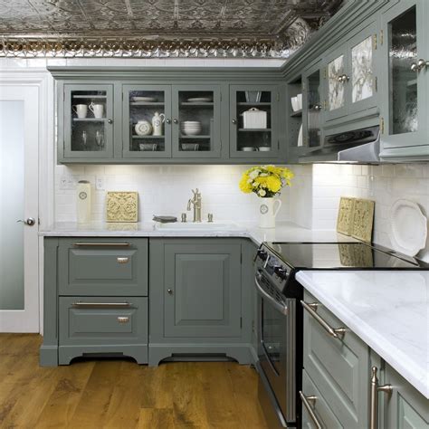 Rich natural wood with soft blue kitchen cabinet colors. Colin & Justin - Viewing Interiors