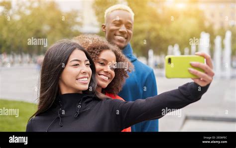 Multi Ethnic Friends Outdoor Taking A Selfie On Smartphone Diverse
