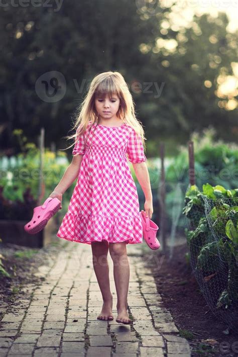 Small Girl At The Garden 905928 Stock Photo At Vecteezy