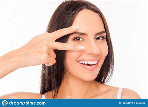 Cheerful Healthy Woman Gesturing With Two Fingers Near Her Eyes Stock
