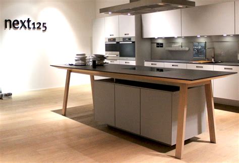 The kitchen's layout largely influences the choice between a table and an island. German brand Schuller dominates KBB Birmingham - KBB News