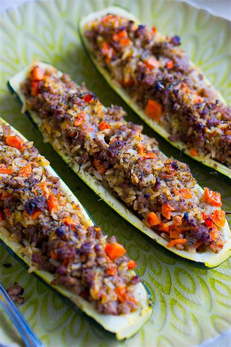 Zucchini halves are filled with ground chicken and provolone cheese, then topped with parmesan cheese creating stuffed zucchini boats the whole family will love. Stuffed Zucchini Boats with Garlic Sauce | Delicious Meets Healthy