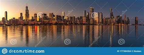 Chicago Skyline Cityscape At Night With Lake In Front And Blue Sky With