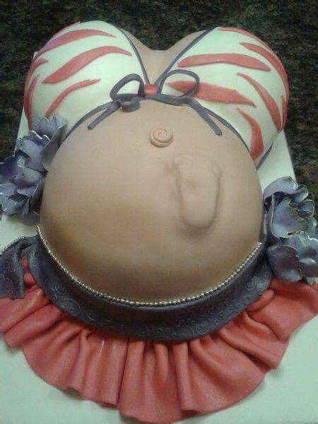 A Cake Shaped Like A Pregnant Woman S Head With Pink And Blue Ruffles