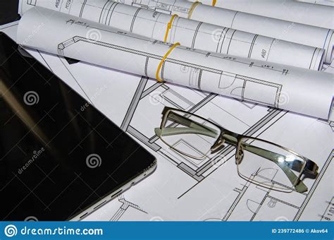 Architects Work Table With Technical Drawings And Tablet Computer Stock