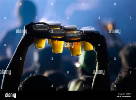 Ambiance During Live Rock Concert And Man Bringing Pints Of Beer In