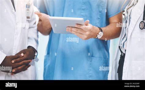 Teamwork Healthcare And Doctors Planning On Digital Tablet Sharing