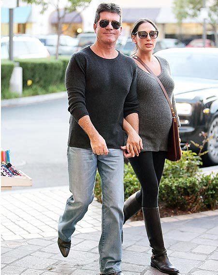 simon cowell plays doting dad to be with pregnant lauren silverman ok magazine