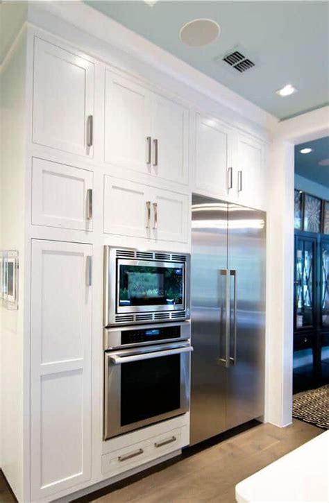 All bridge cabinets are 36 in. 32 Kitchen Cabinets Around Refrigerator for more Storage Space