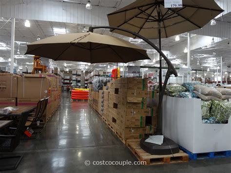 Outdoor umbrellas complete the patio furniture setup. 11 Foot Parisol Cantilever Umbrella