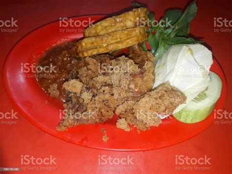 Pecel Ayam Fried Chicken And Chili Sauce And Vegetables Stock Photo