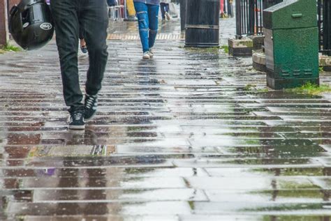Pedestrian Feet Walking In The Rain In Chiswick Street Stock Photo