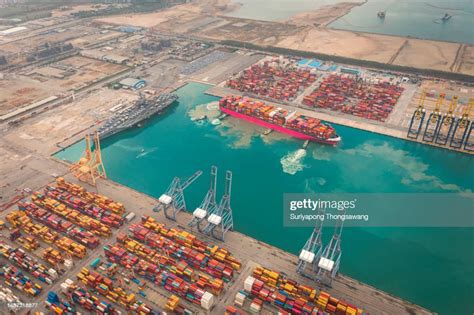 Aerial View Tug Boat Pulling Container Cargo Ship To Loading Dock On