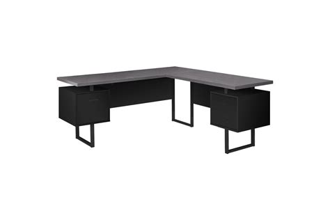Do you know of a large tree trunk on your property that is doing nothing but losing space? Black and Grey Extra Long Corner Computer Desk by Monarch