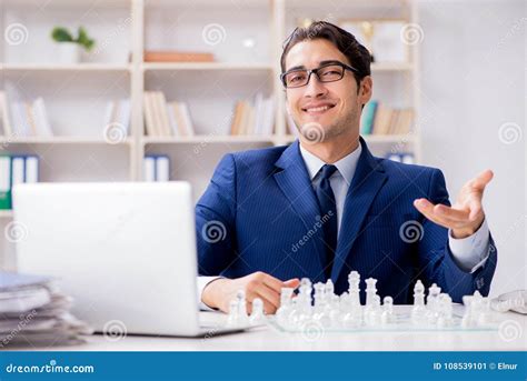 The Young Businessman Playing Glass Chess In Office Stock Image Image