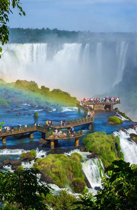 Tourists At Iguazu Falls One Of The Worlds Great Natural Wonders On