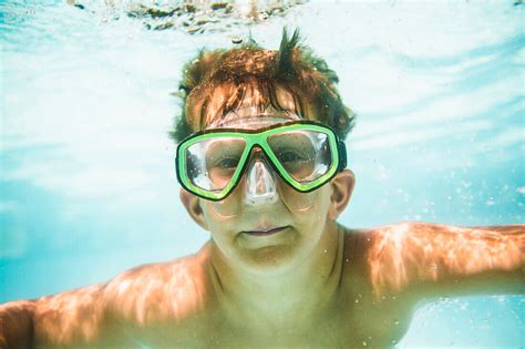 Caucasian Boy Swimming Underwater In License Image 71064049