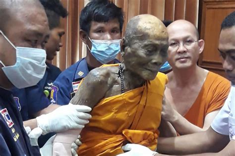 Dead Buddhist Monk Smiles As His Body Is Exhumed Two Months After