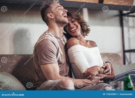 Two Happy Mixed Race Couple Having Fun At The Coffee Shop Stock Image