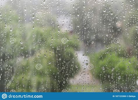 Raindrops On The Window Pane Outside The Window You Can See The