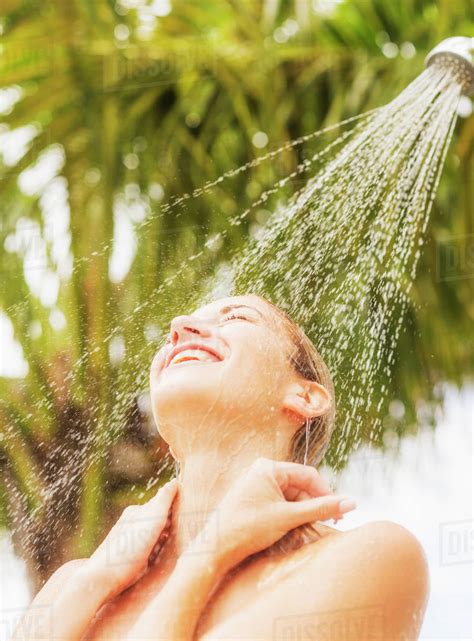 Woman Taking Shower Outdoors Stock Photo Dissolve