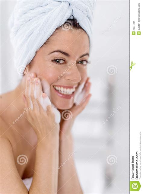 Middle Aged Woman Cleaning Her Sking Over The Sink Stock Image Image