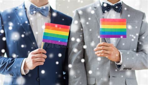 close up of male gay couple holding rainbow flags stock image image of person gender 63398379
