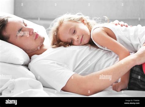 Father And Babe Sleeping Bed High Resolution Stock Photography And