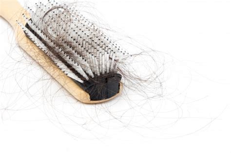 Hair fall in women vs men Comb with hair loss problem | Premium Photo