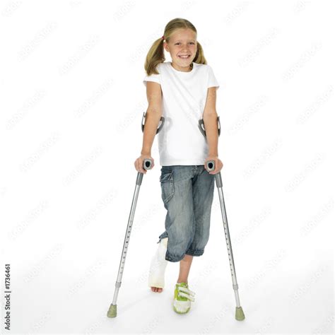Girl With A Broken Leg Walking On Crutches Stock Photo Adobe Stock