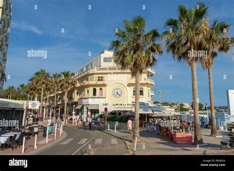 Shops Restaurants And Palm Trees Along The Seafront Of Juan Les Pins