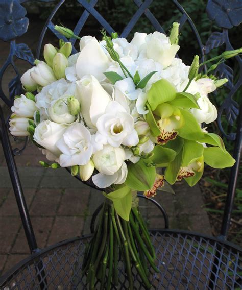 Bridal Bouquet Of Green Cymbidium Orchids White Roses And Freesia