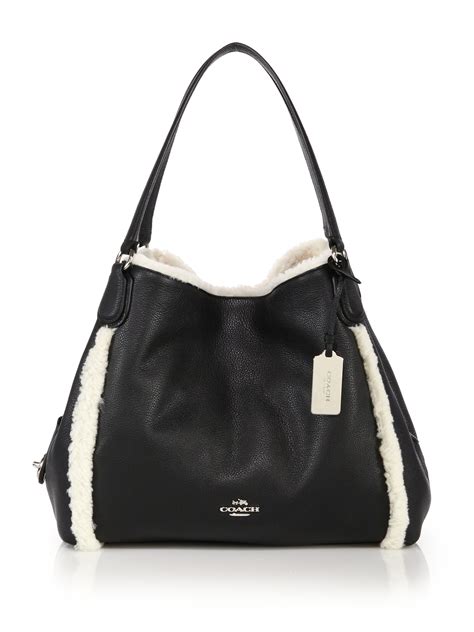 Lyst Coach Edie Shearling And Leather Shoulder Bag In Black