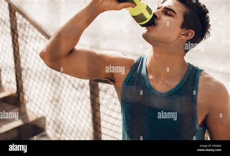 Man Drinking Water After Running Workout At Beach Thirsty Healthy Male