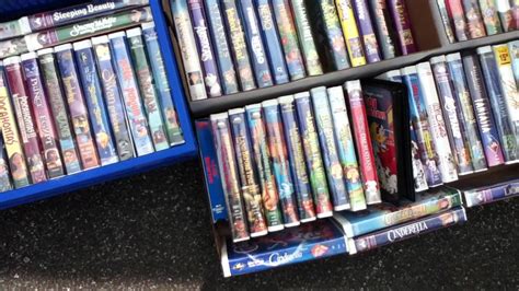 Box Lot Of Disney Vhs Tapes And Disney Print Big Valley Auction