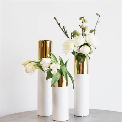 View a wide selection of wedding accessories and other great items on stunning white and gold 12, 16 and 20 tall ceramic cylinder vase, which measures 4 wide with a beautiful metallic gold glaze at the top. White & Gold 20in Klein Vase