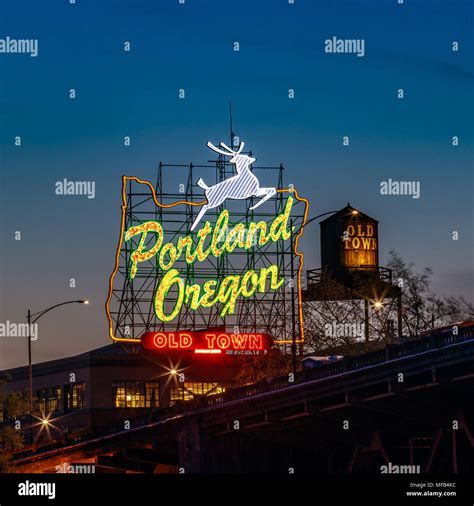 Sunset Over The Iconic Portland Oregon Old Town Sign In Downtown