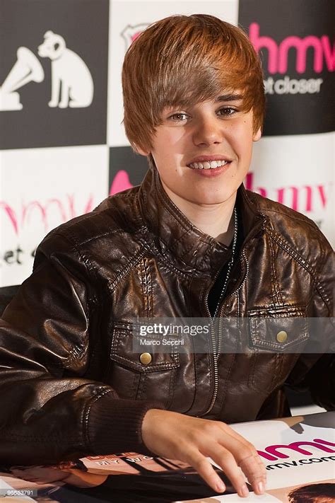Teenage Pop Sensation Justin Bieber Meets Fans And Signs Copies Of