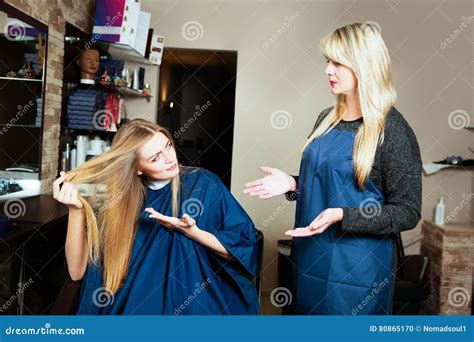 Beautiful Girl Showing Her Hair To Hairdresser Stock Photo Image Of