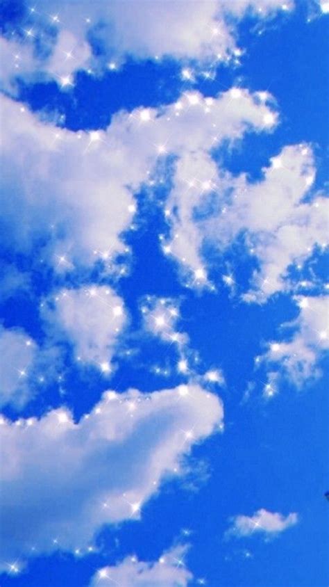 An Airplane Flying In The Blue Sky With White Clouds