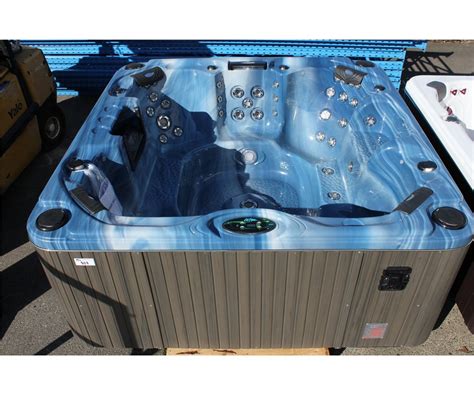 Cal Spas Escape Select Series Hot Tub With Sky Blue Interior And 8 Grey Cabinet C W