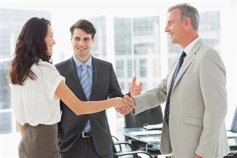 Businessman Introducing Colleagues In The Office Boomers Social