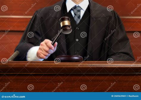 Male Judge Striking The Gavel After Giving Verdict In The Courtroom
