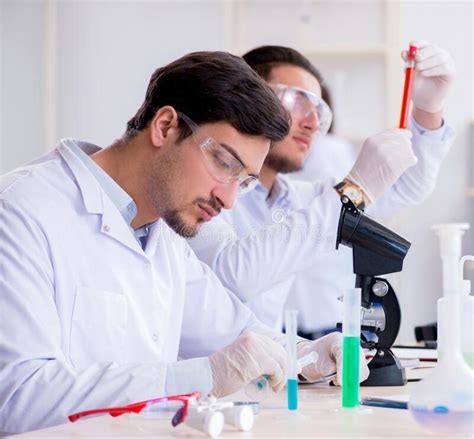 Team Of Chemists Working In The Lab Stock Photo Image Of Analyzing