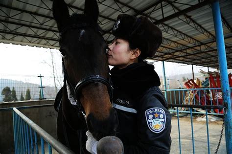 Dalians Mounted Policewoman In Full Leather Uniform Riding Helmets